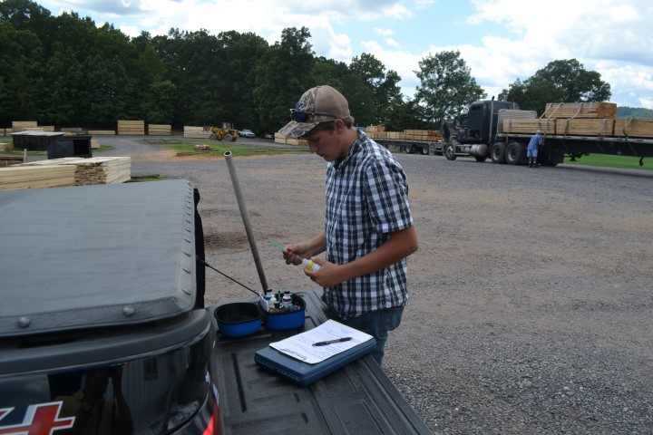 Intern checking customer's dip tank