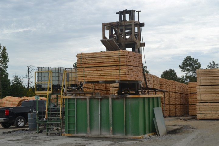 Landscape lumber being dipped