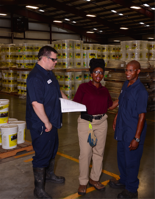 Three employees in warehouse